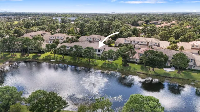 aerial view of a house with a lake view