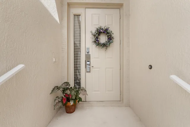 a view of a hallway with paintings on the wall