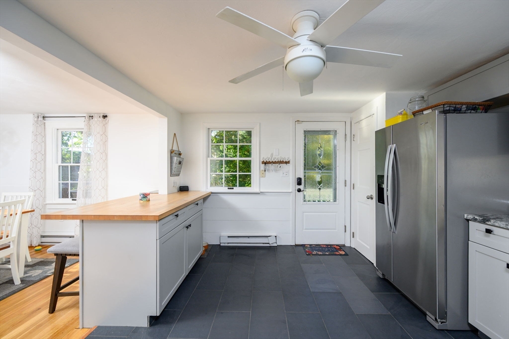 19 Langford Road Plymouth, MA 02360 - Photo 11 of 33 a bathroom with a double vanity sink a large mirror and a bathtub