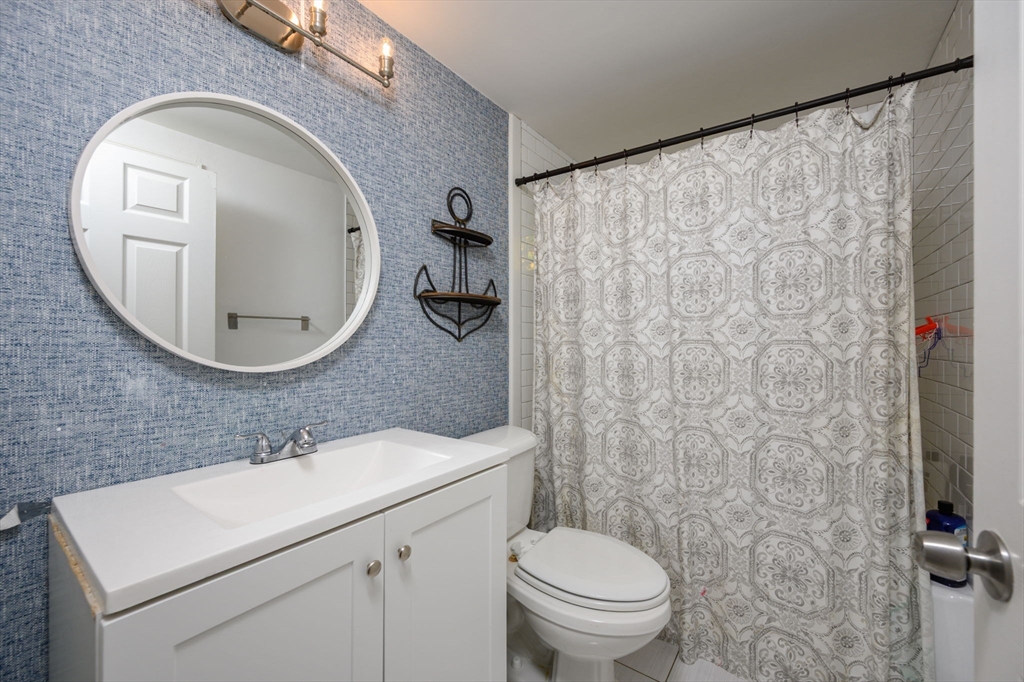 19 Langford Road Plymouth, MA 02360 - Photo 18 of 33 a bathroom with a toilet sink and mirror