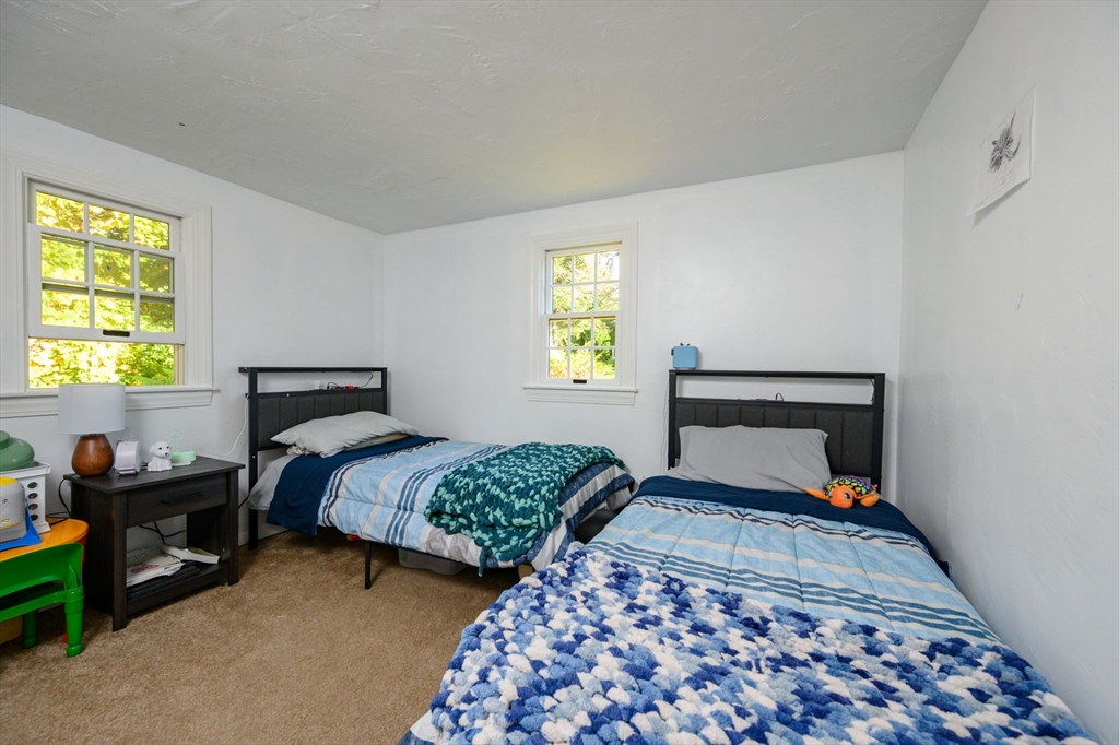 19 Langford Road Plymouth, MA 02360 - Photo 19 of 33 a bedroom with two beds and a window