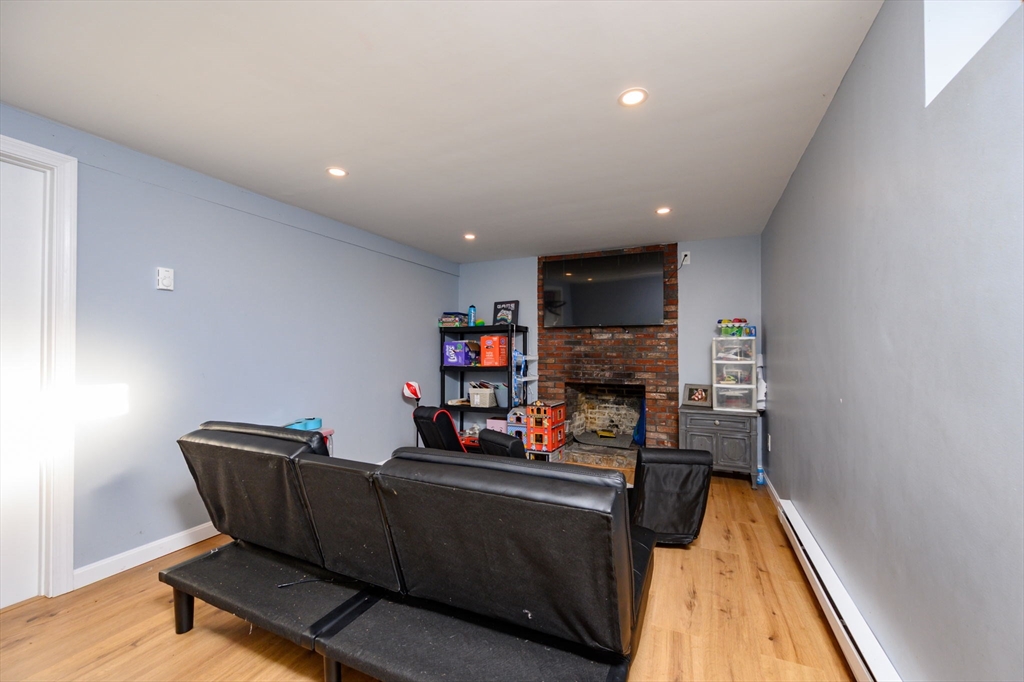 19 Langford Road Plymouth, MA 02360 - Photo 21 of 33 a living room with furniture and a wooden floor