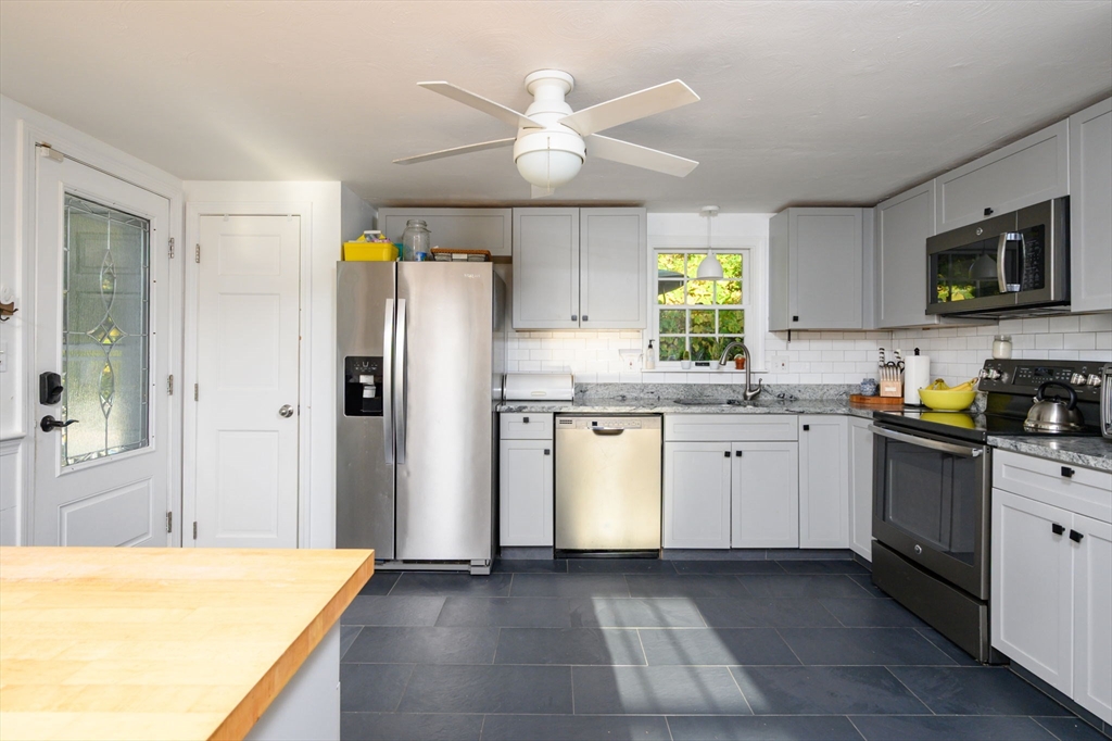 19 Langford Road Plymouth, MA 02360 - Photo 9 of 33 a kitchen with a refrigerator a stove a microwave and cabinets