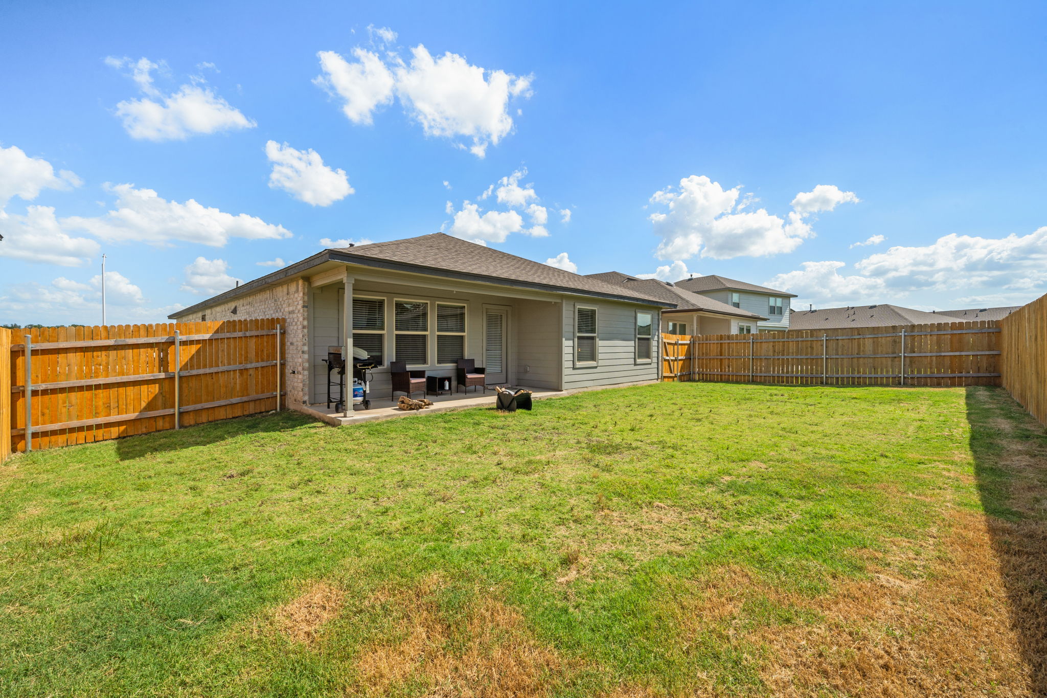 1117 Tipton Street Georgetown, TX 78633 - Photo 38 of 40 Expansive backyard featuring a lush lawn and perimeter wood fencing