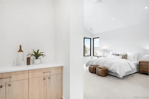 a bedroom with a bed and a sink