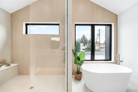 a white bath tub sitting next to a white tub