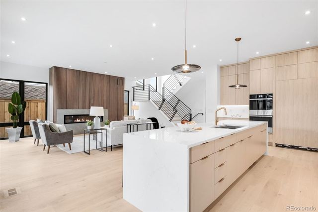 a view of kitchen with sink and window