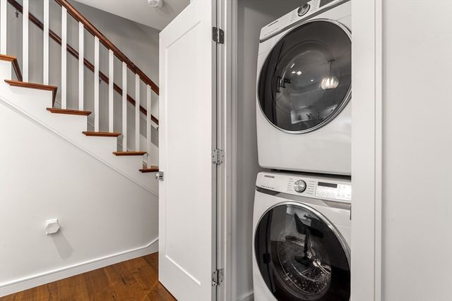 a view of a hallway with washer and dryer