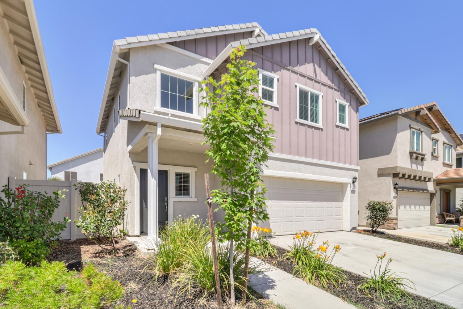 front view of a house with a yard