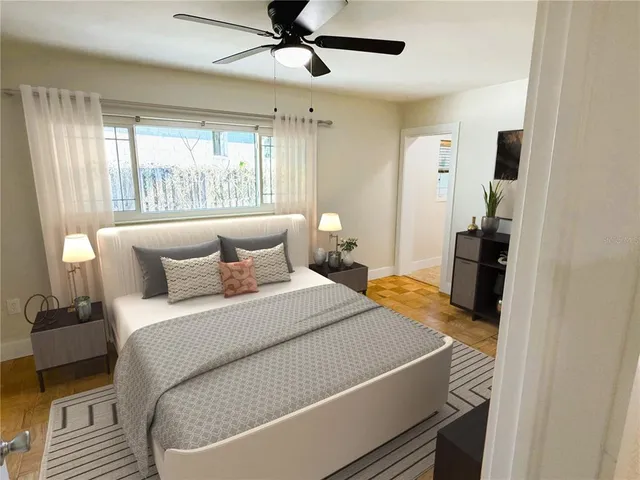 a bedroom with a large bed and a window