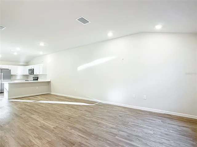 a view of kitchen with wooden floor