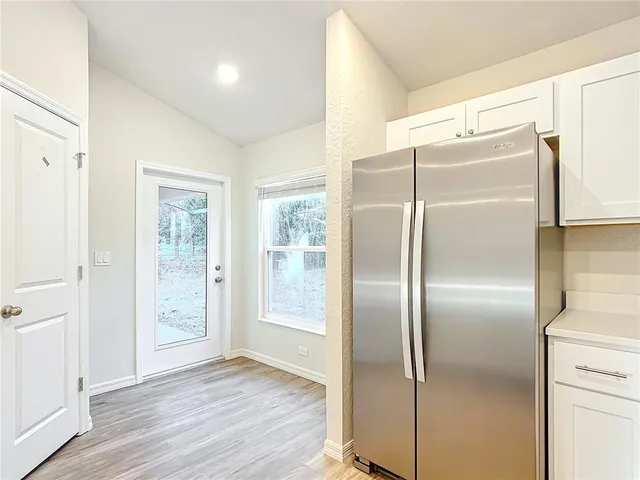 a bathroom with a glass shower door