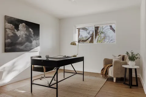 a view of a workspace with furniture