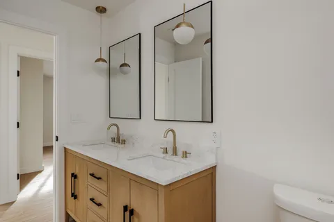 a bathroom with a sink vanity and a mirror