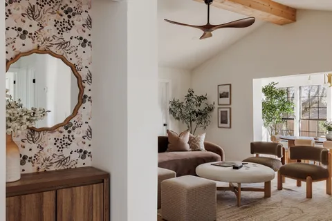 a living room with furniture fireplace and a large mirror