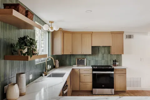 a kitchen with a sink and cabinets