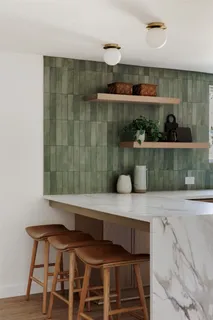 a kitchen with a table and chairs in it