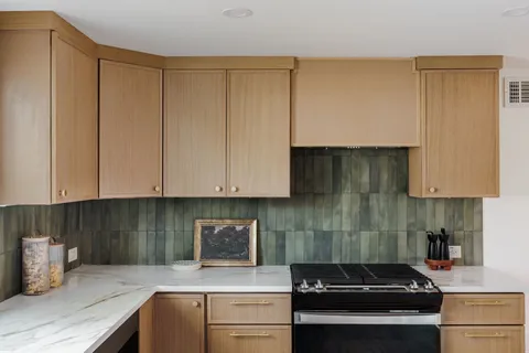 a kitchen with a sink and cabinets