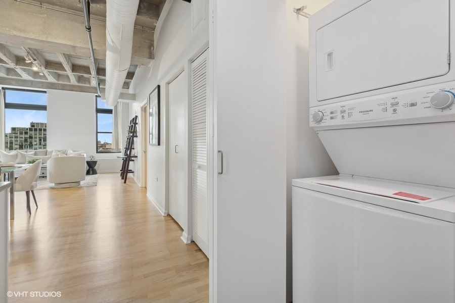 1503 South State Street, Unit 506 Chicago, IL 60605 - Photo 14 of 16 a view of a hallway with wooden floor and workspace
