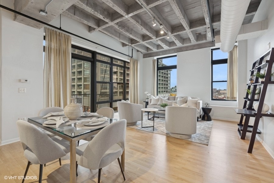 1503 South State Street, Unit 506 Chicago, IL 60605 - Photo 3 of 16 a view of a dining room with furniture window and wooden floor