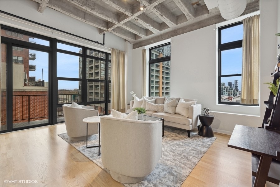 1503 South State Street, Unit 506 Chicago, IL 60605 - Photo 4 of 16 a living room with furniture and a large window