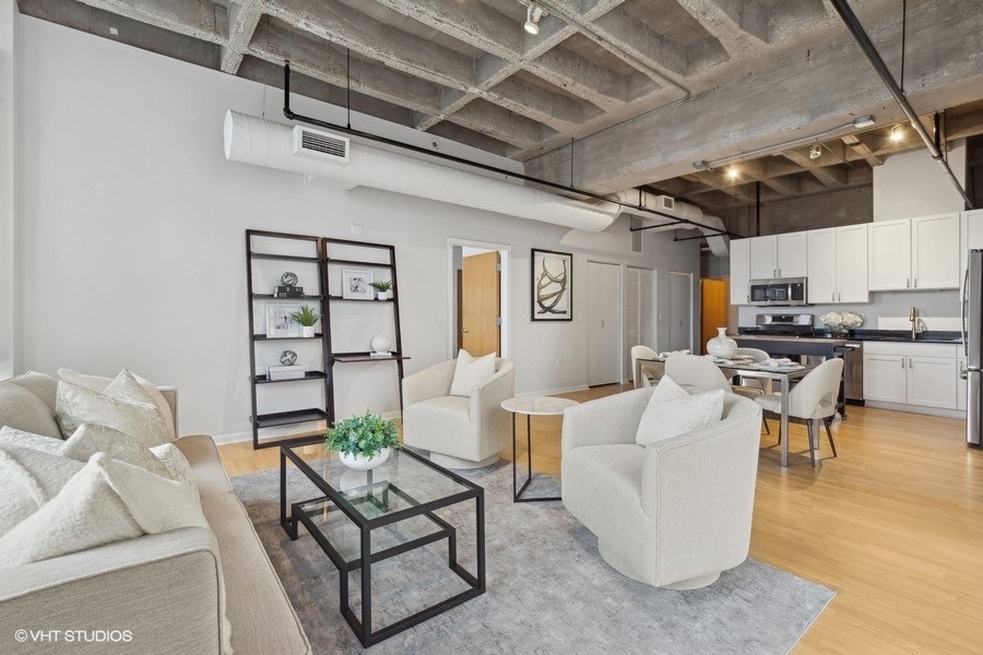 1503 South State Street, Unit 506 Chicago, IL 60605 - Photo 5 of 16 a living room with furniture and white walls