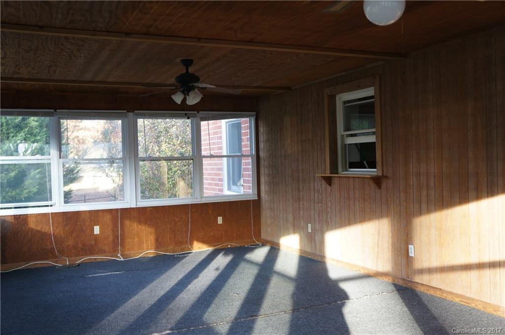604 Banks Street Fort Mill, SC 29715 - Photo 11 of 16 a view of empty room with wooden floor and fan