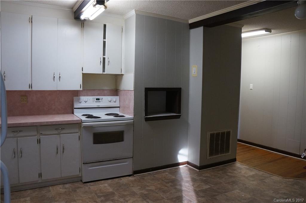 604 Banks Street Fort Mill, SC 29715 - Photo 5 of 16 a kitchen with a sink and a stove top oven
