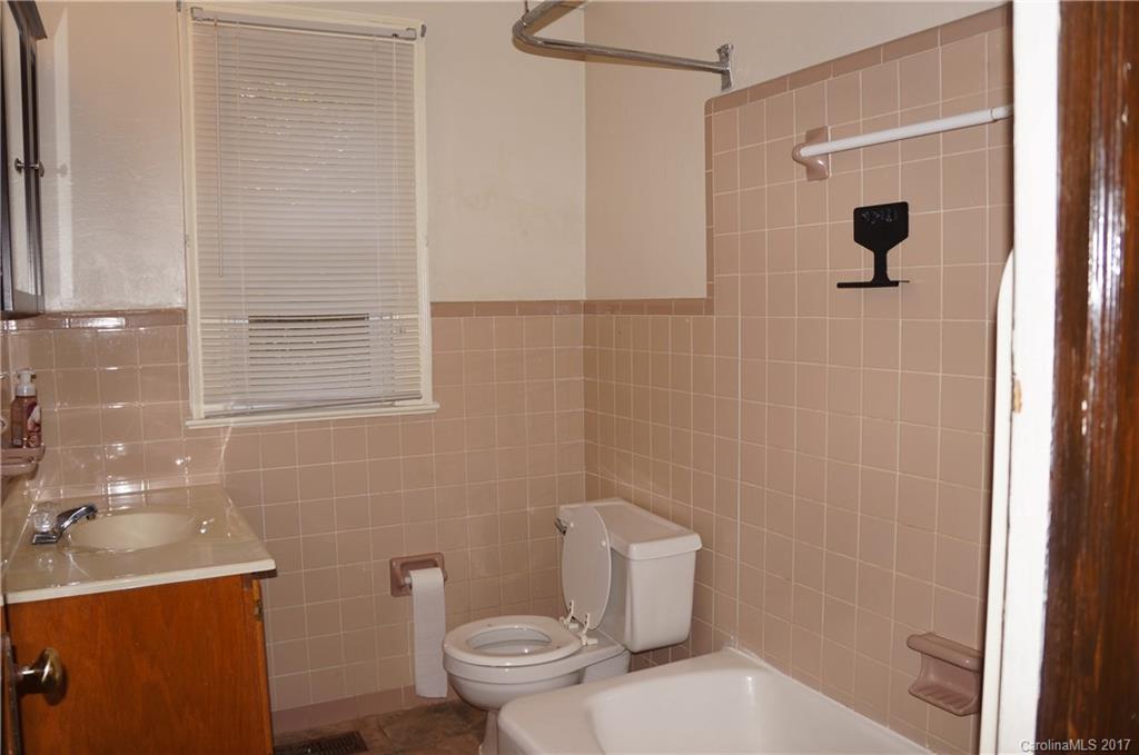 604 Banks Street Fort Mill, SC 29715 - Photo 6 of 16 a bathroom with a toilet and shower