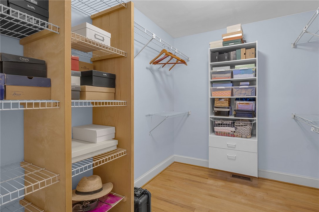 218 Northridge Drive Anderson, SC 29621 - Photo 24 of 50 Ample storage solutions abound in this meticulously organized walk-in closet with durable hardwood flooring.