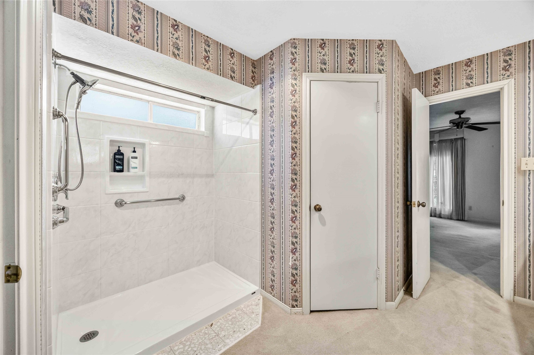 6302 Meadowtrace Drive Spring, TX 77389 - Photo 19 of 35 Additional view of the primary bath showing the walk-in shower and access to the suite's two closets.