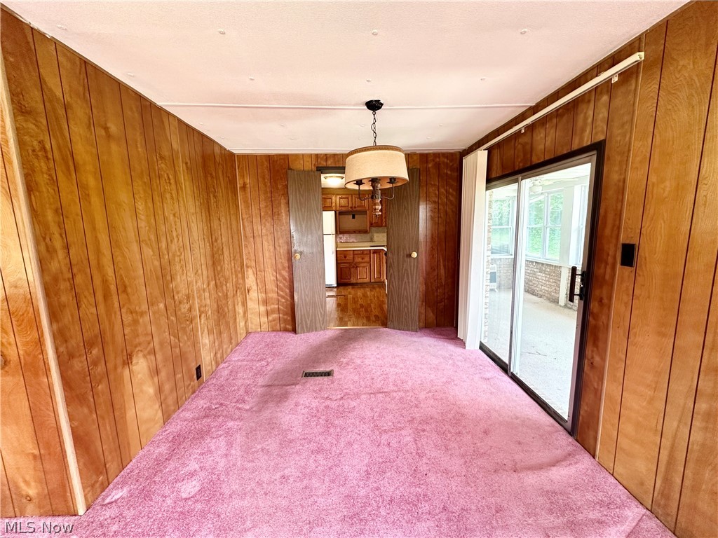 28 Richter Road Colliers, WV 26035 - Photo 8 of 38 Dining room featuring a chandelier and access to sun room