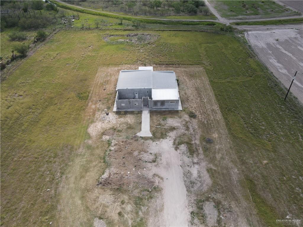 1424 North Sky Soldier Road Weslaco, TX 78596 - Photo 30 of 33 a aerial view of a house with a yard