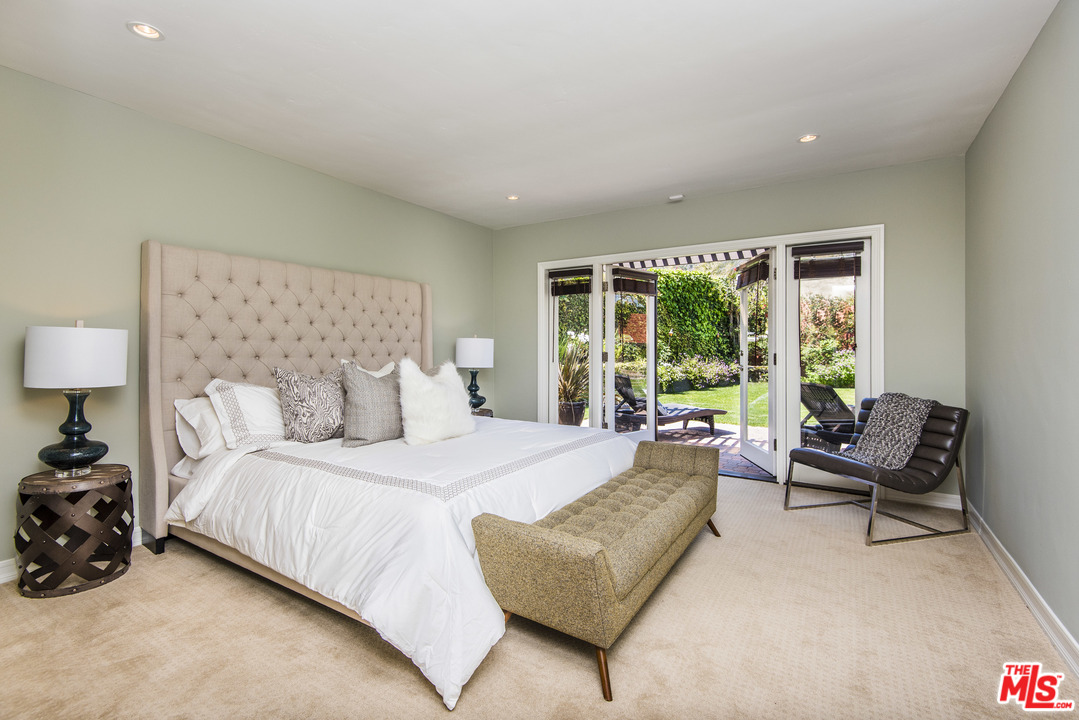 3612 Surfwood Road Malibu, CA 90265 - Photo 11 of 19 a bedroom with a bed and a couch