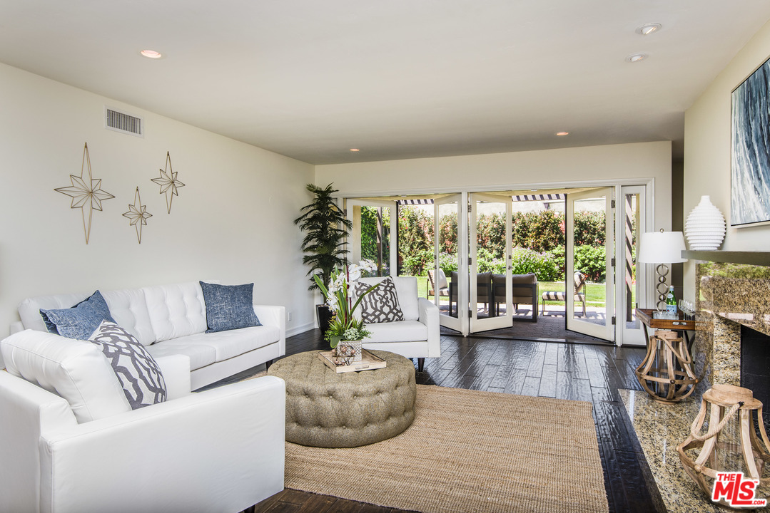 3612 Surfwood Road Malibu, CA 90265 - Photo 5 of 19 a living room with furniture and a large window