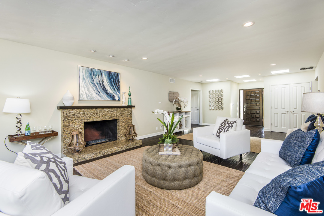 3612 Surfwood Road Malibu, CA 90265 - Photo 6 of 19 a living room with furniture and a fireplace