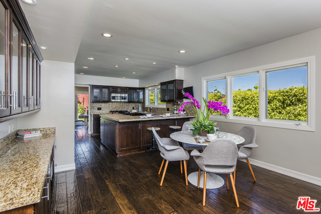 3612 Surfwood Road Malibu, CA 90265 - Photo 10 of 19 a view of a dining room with furniture and a kitchen