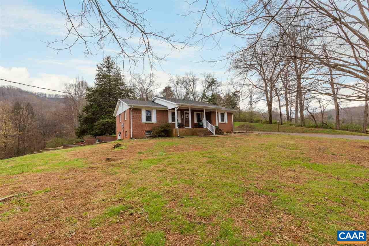 2564 Stagebridge Road Lovingston, VA 22949 - Photo 1 of 47 a front view of a house with a yard