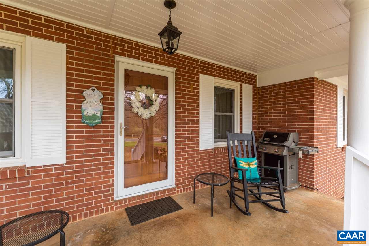 2564 Stagebridge Road Lovingston, VA 22949 - Photo 11 of 47 a front view of a house with outdoor seating
