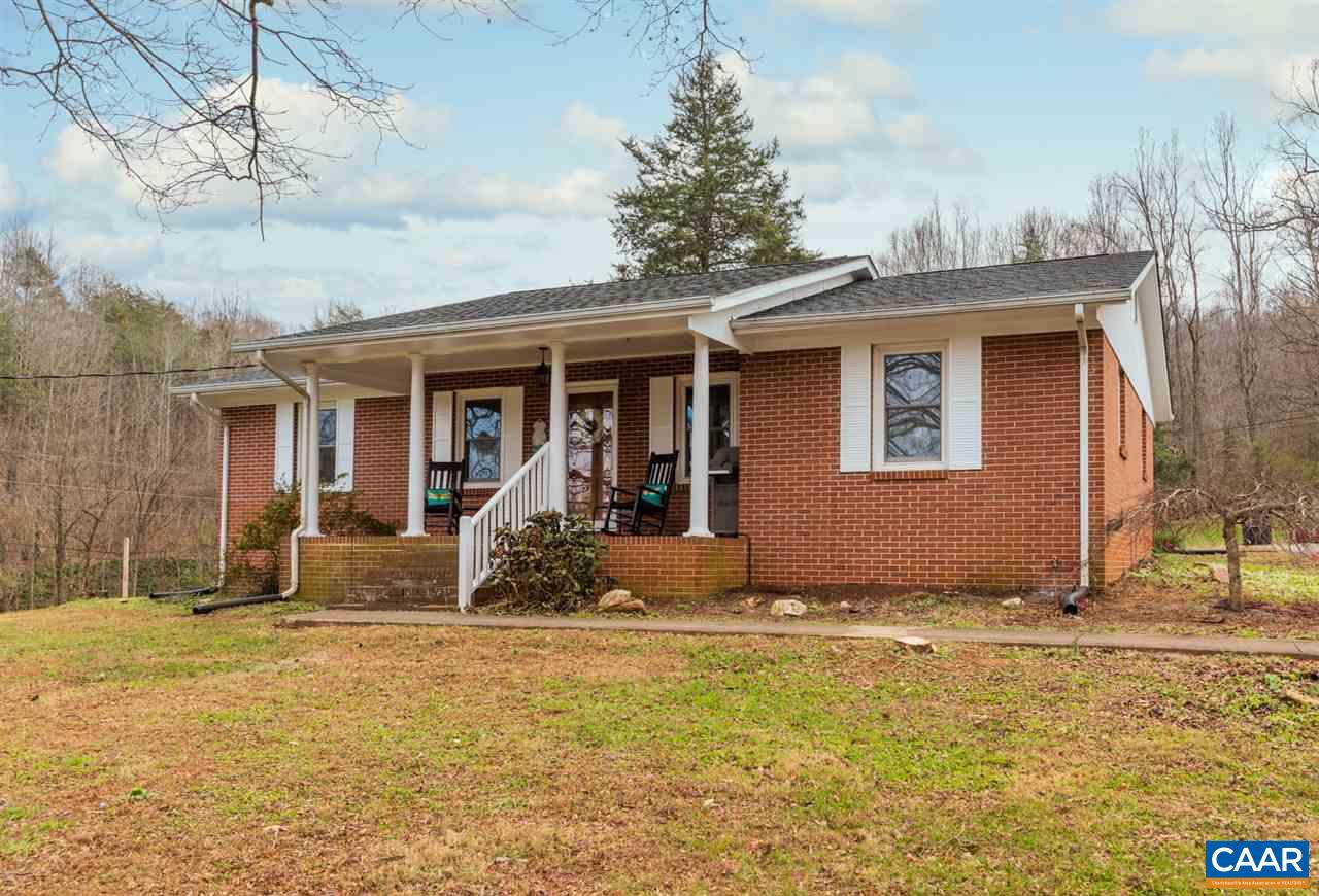 2564 Stagebridge Road Lovingston, VA 22949 - Photo 2 of 47 a front view of a house with glass windows