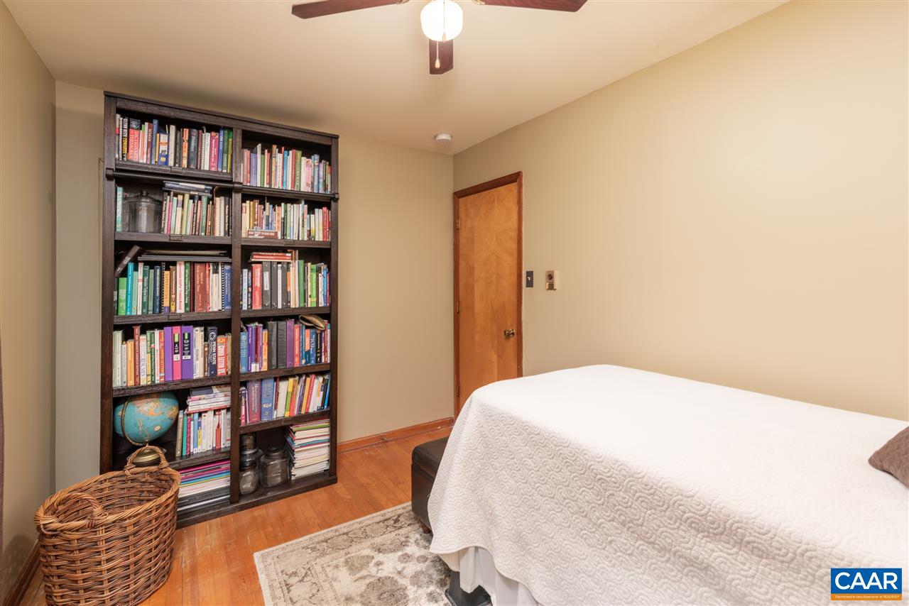 2564 Stagebridge Road Lovingston, VA 22949 - Photo 30 of 47 a bedroom with a bed and a book shelf