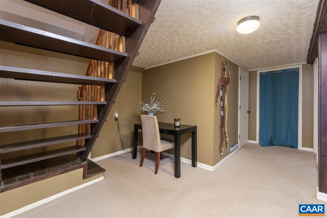 2564 Stagebridge Road Lovingston, VA 22949 - Photo 33 of 47 a view of a livingroom with furniture and staircase