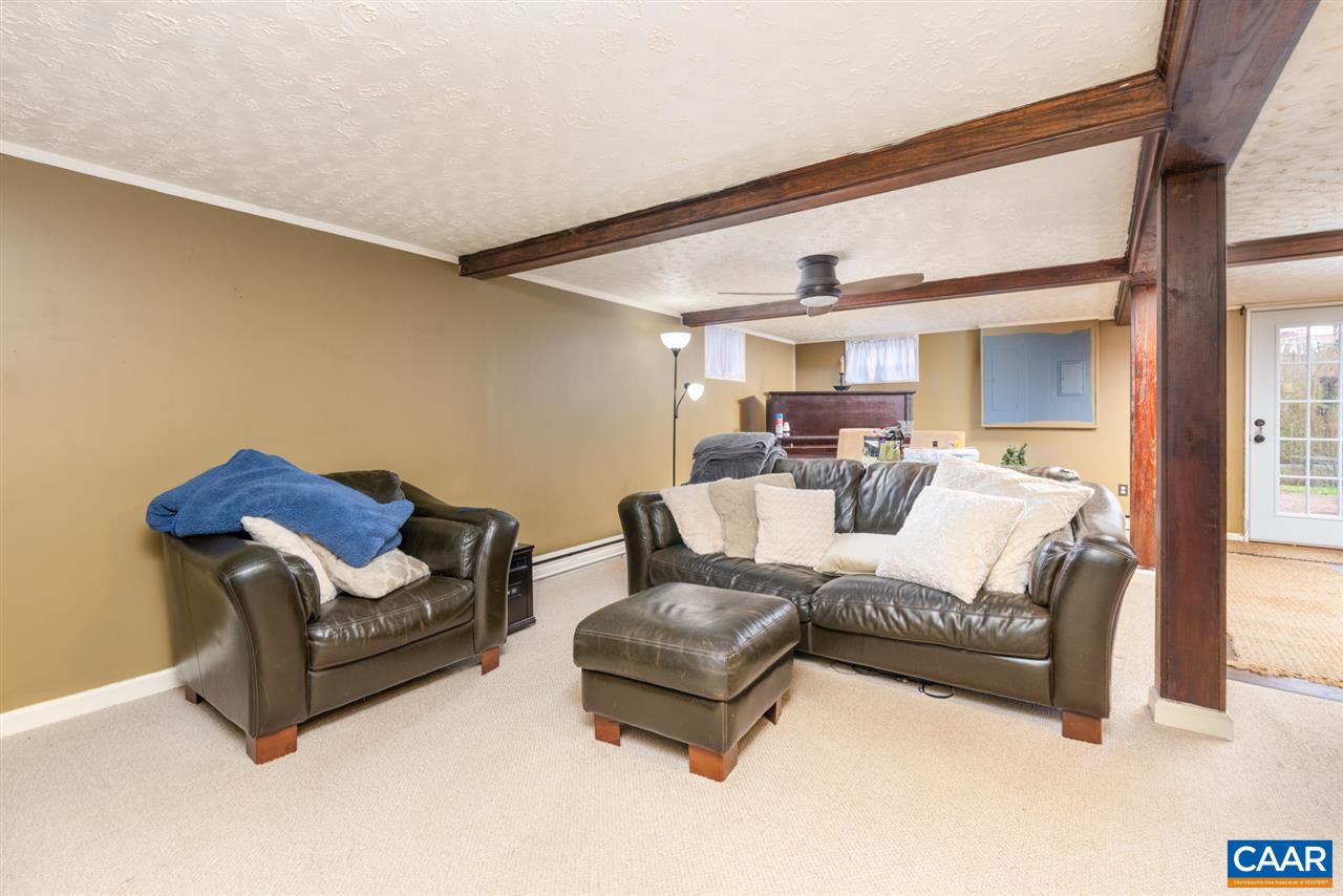 2564 Stagebridge Road Lovingston, VA 22949 - Photo 34 of 47 a living room with furniture and a large window