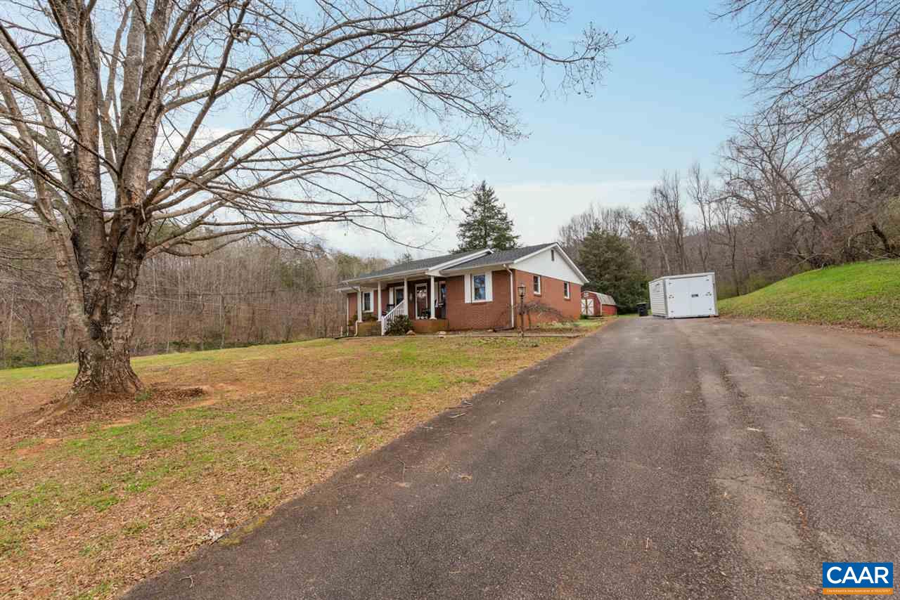2564 Stagebridge Road Lovingston, VA 22949 - Photo 8 of 47 a front view of a house with a yard and trees