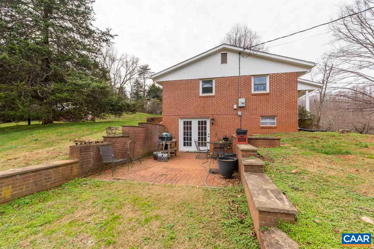 2564 Stagebridge Road Lovingston, VA 22949 - Photo 9 of 47 a view of a house with backyard and a garden
