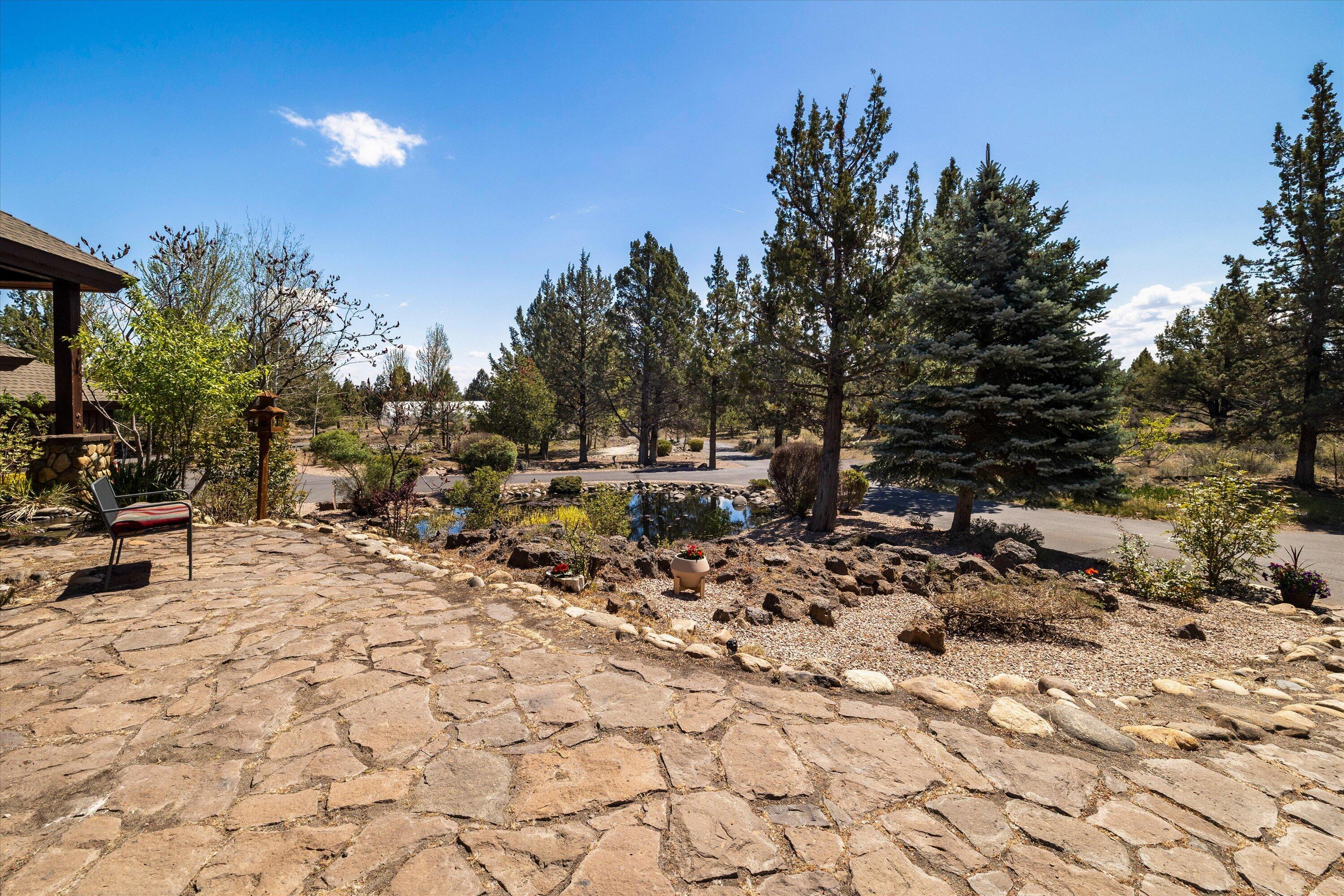 64155 Hunnell Road Bend, OR 97703 - Photo 78 of 96 Perfect bench spot overlooking the pond.