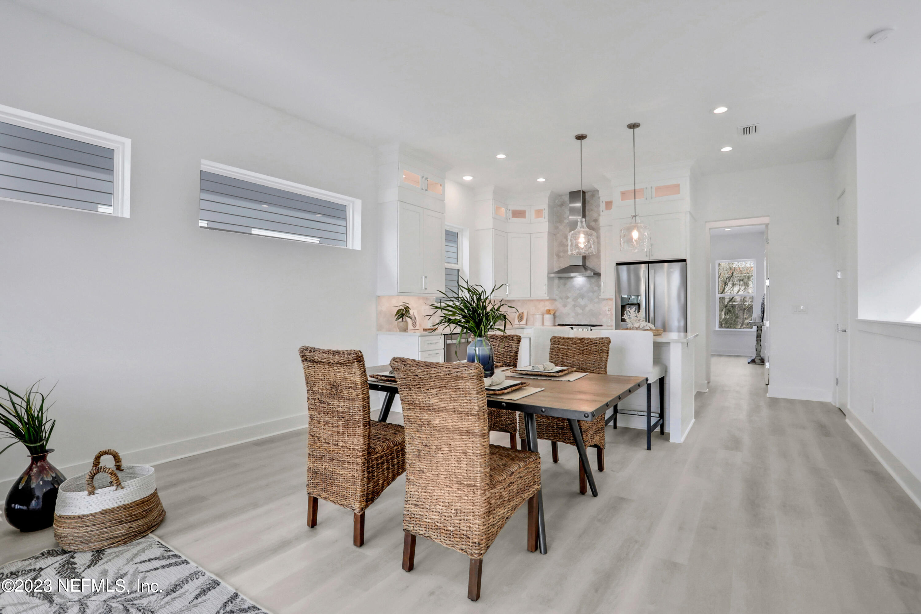 2107 Gordon Avenue Jacksonville Beach, FL 32250 - Photo 22 of 36 a view of a dining room with furniture and wooden floor