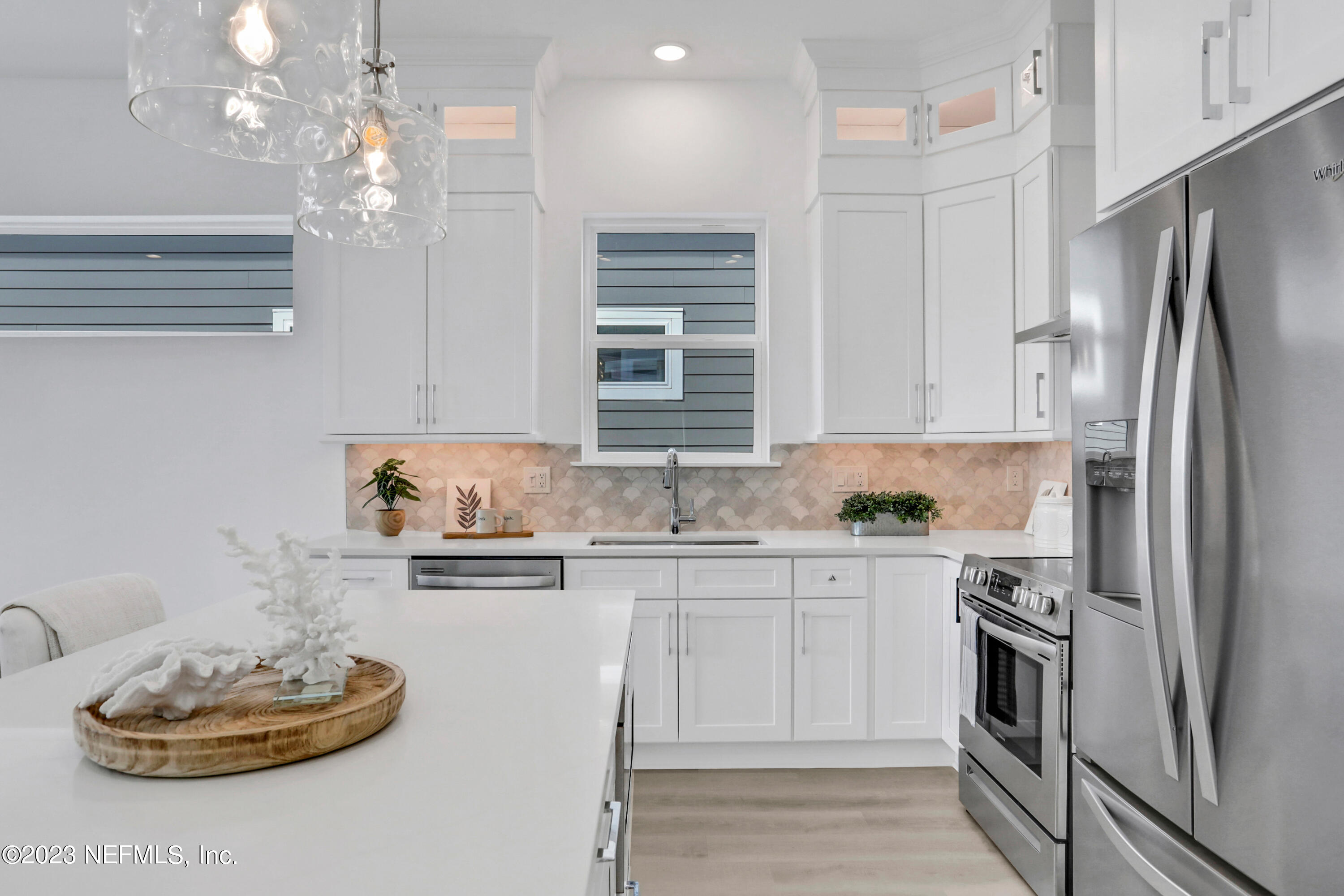 2107 Gordon Avenue Jacksonville Beach, FL 32250 - Photo 25 of 36 a kitchen with a sink stainless steel appliances and cabinets