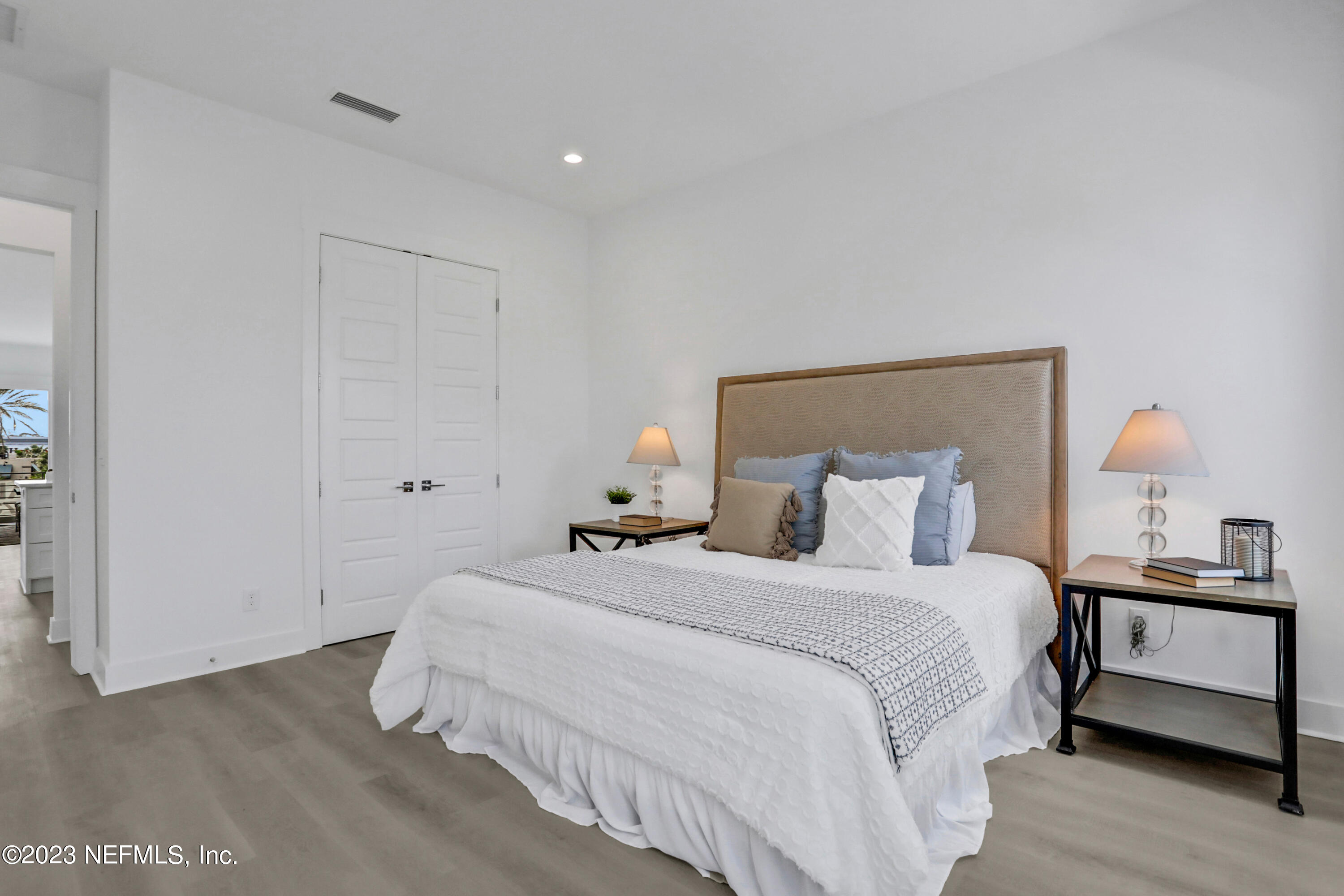 2107 Gordon Avenue Jacksonville Beach, FL 32250 - Photo 28 of 36 a bedroom with a bed and a lamp