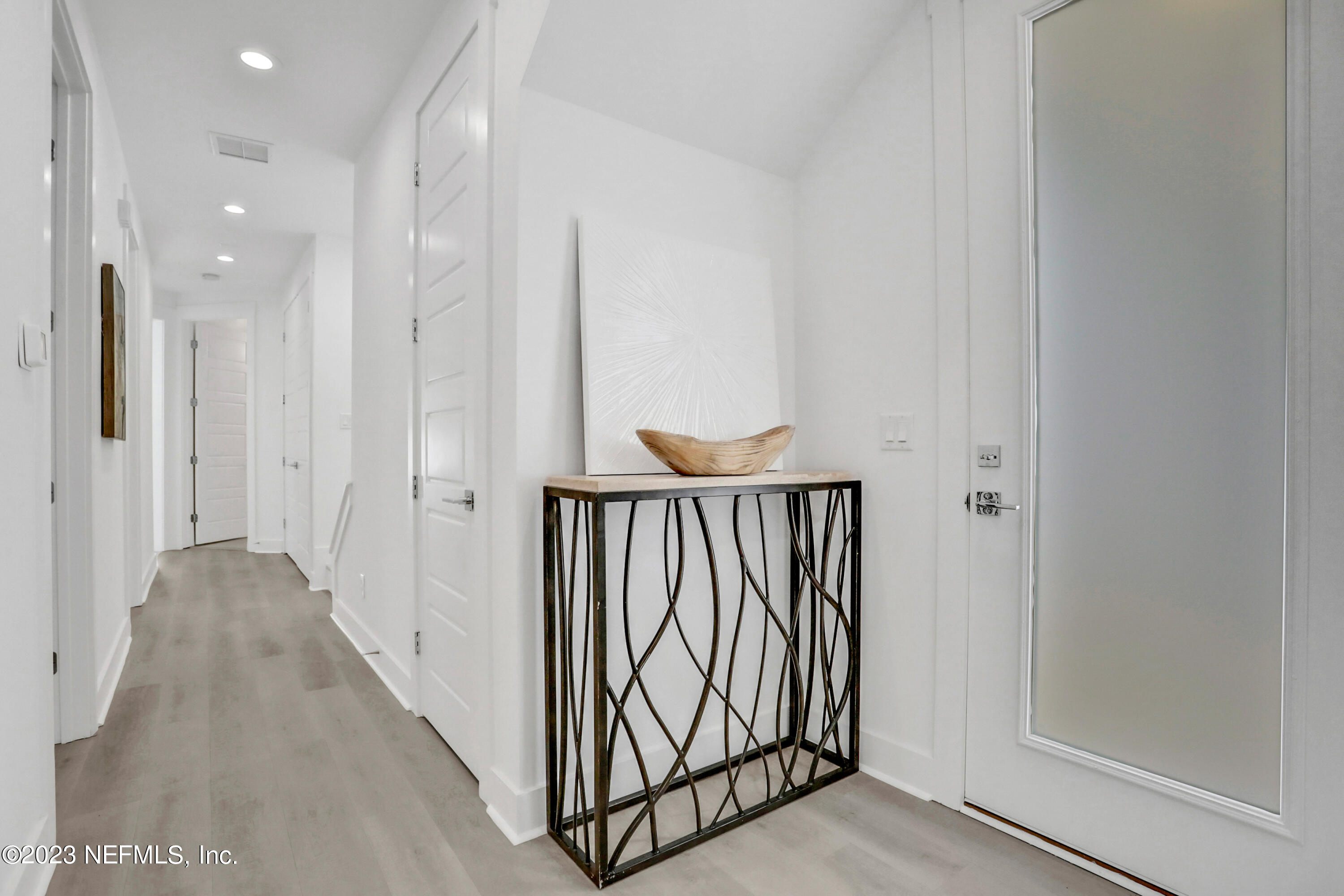 2107 Gordon Avenue Jacksonville Beach, FL 32250 - Photo 3 of 36 a view of a hallway with wooden floor